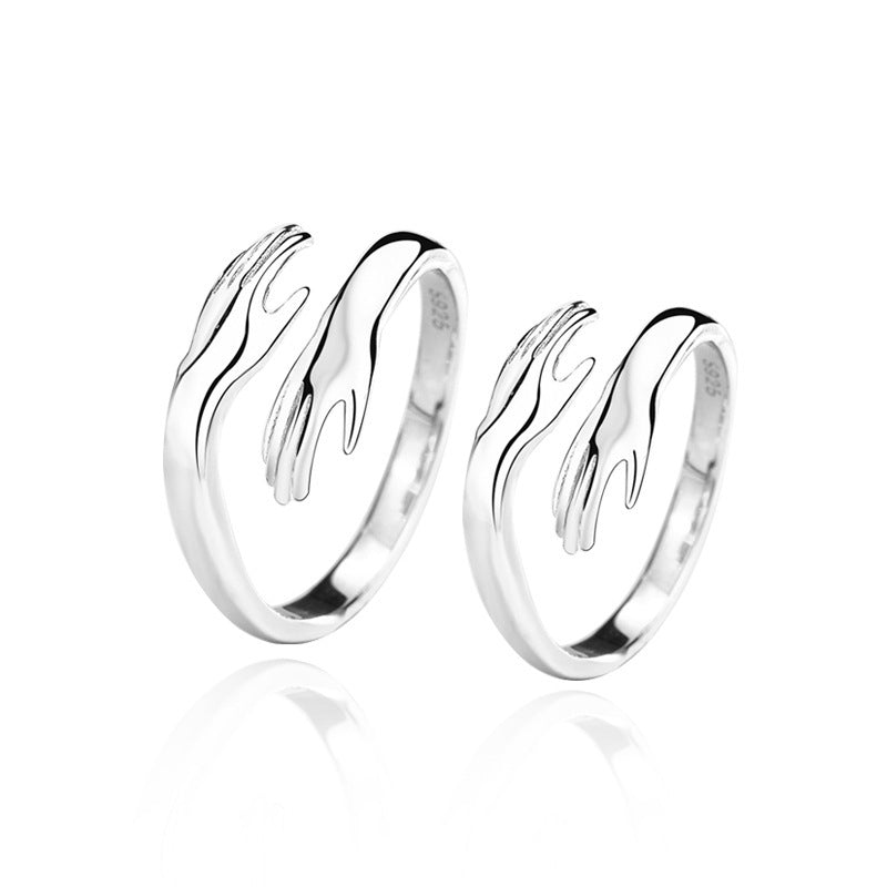 Silver hands hug couple ring