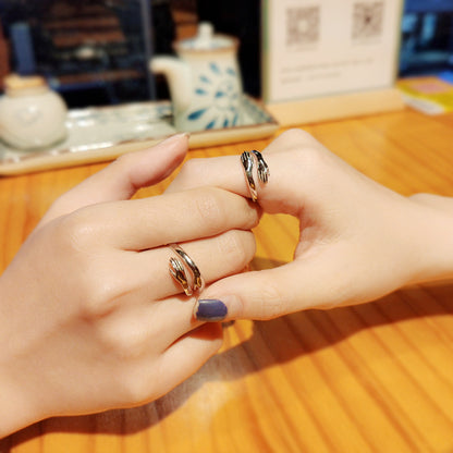 Silver hands hug couple ring